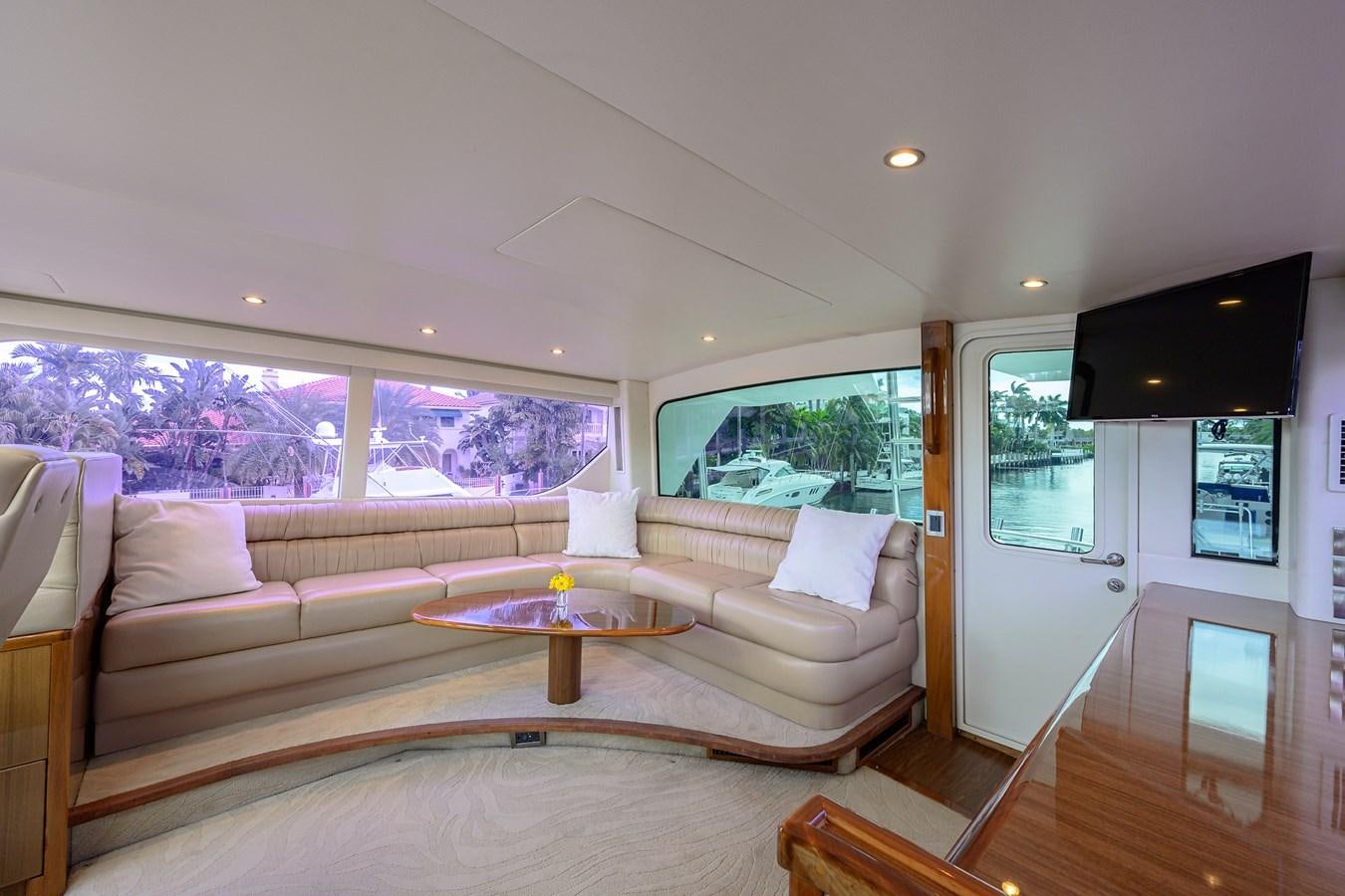 a living room with a couch and a table aboard KNOT RACING Yacht for Sale