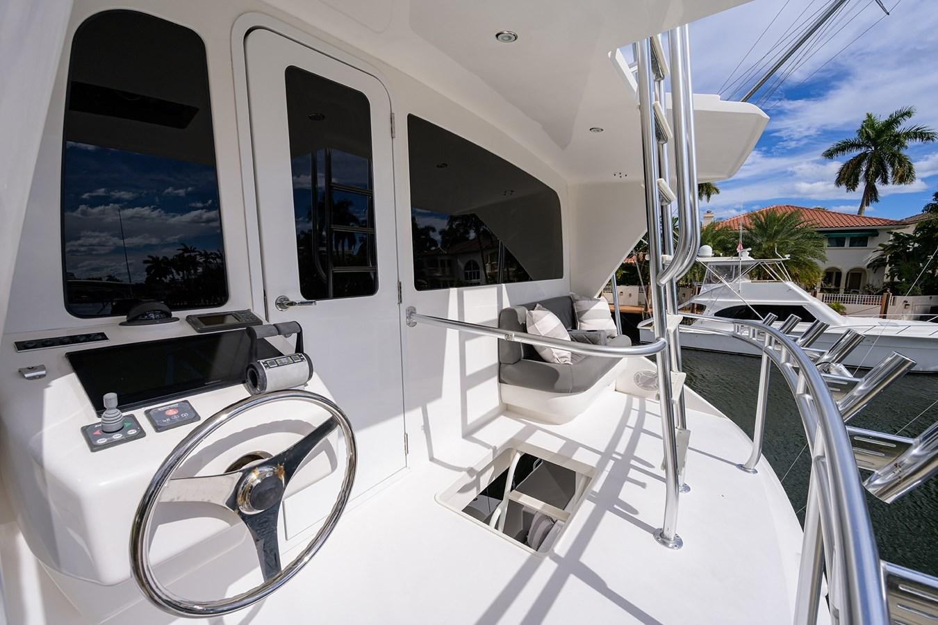 a white boat with a white door aboard KNOT RACING Yacht for Sale