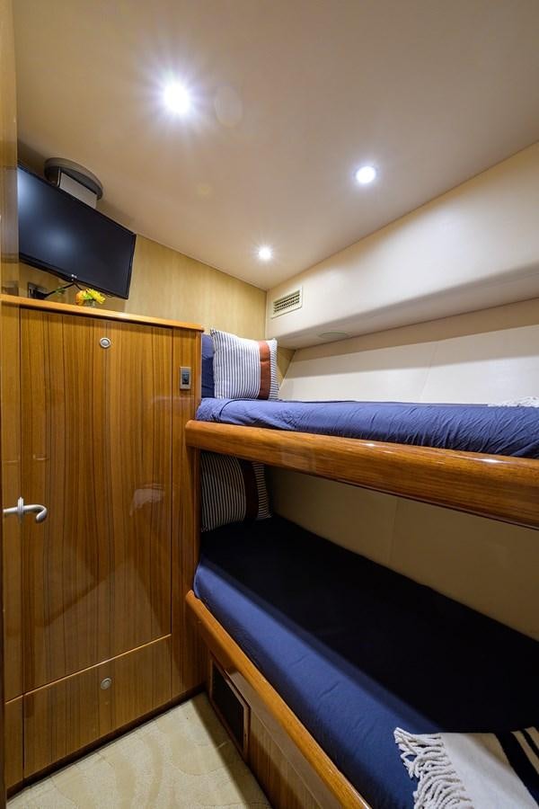 a room with bunk beds aboard KNOT RACING Yacht for Sale