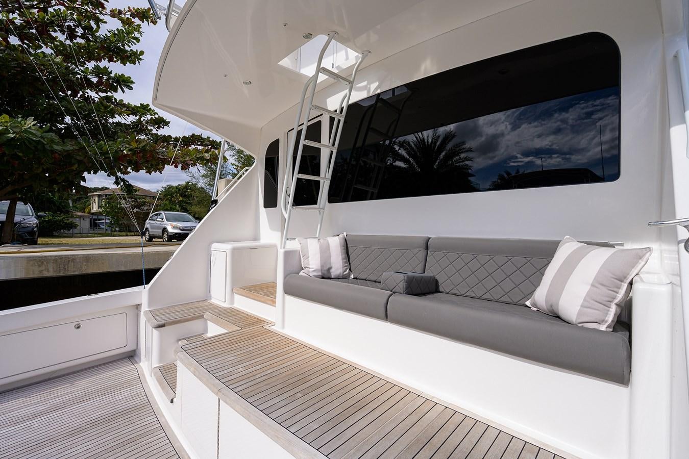 a large white couch in a room aboard KNOT RACING Yacht for Sale