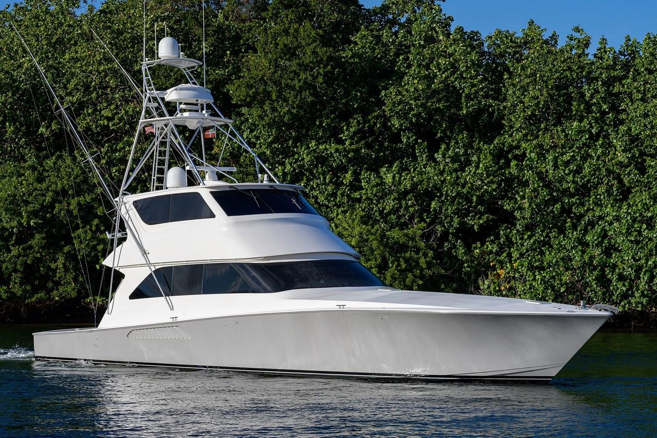 a white boat on the water aboard KNOT RACING Yacht for Sale