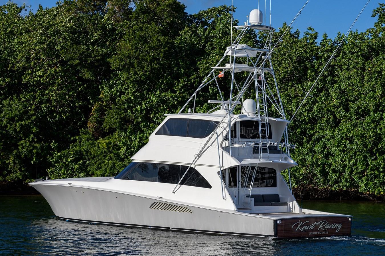 a white boat on the water aboard KNOT RACING Yacht for Sale