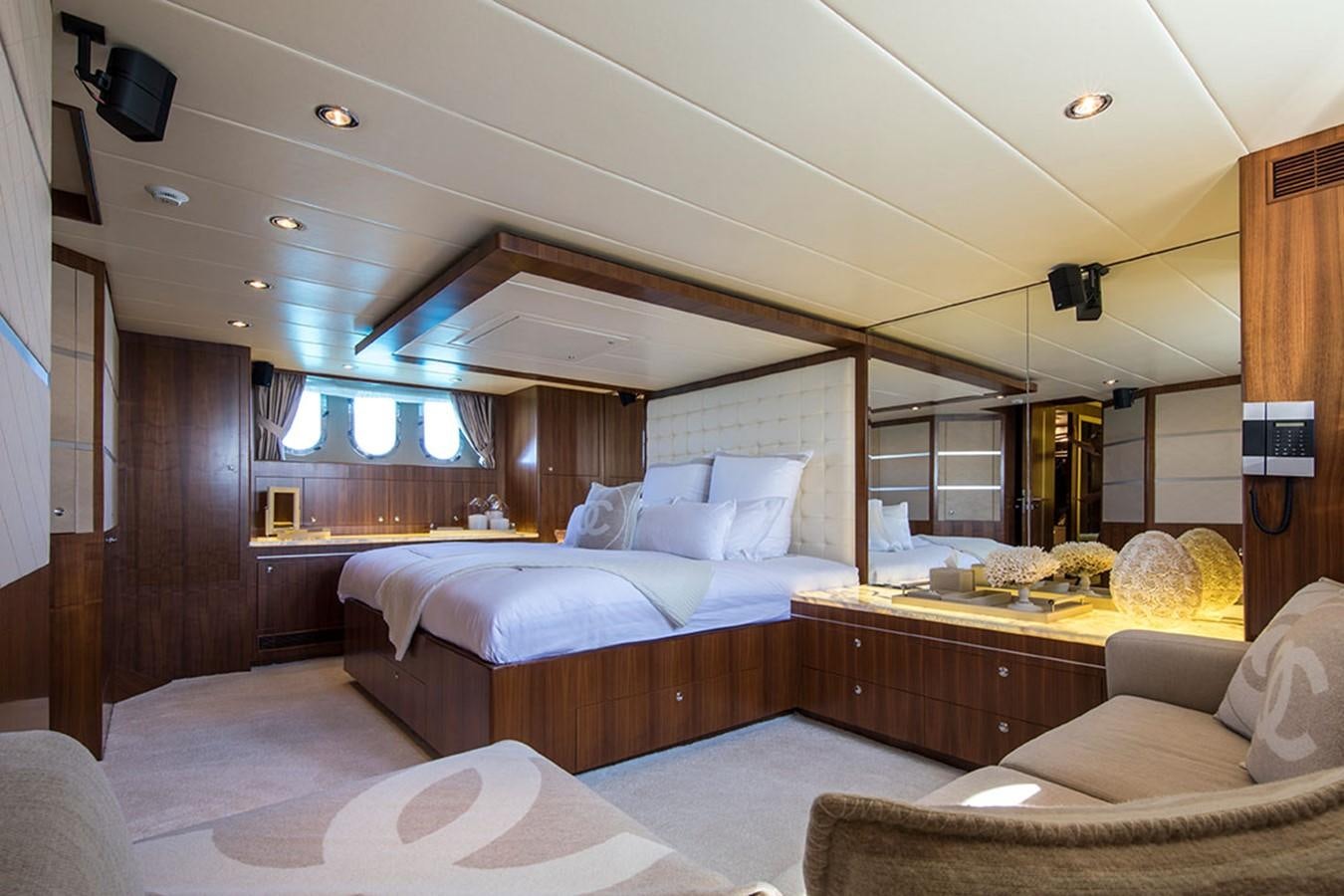 a room with a bed and a desk aboard ETOUPE Yacht for Sale
