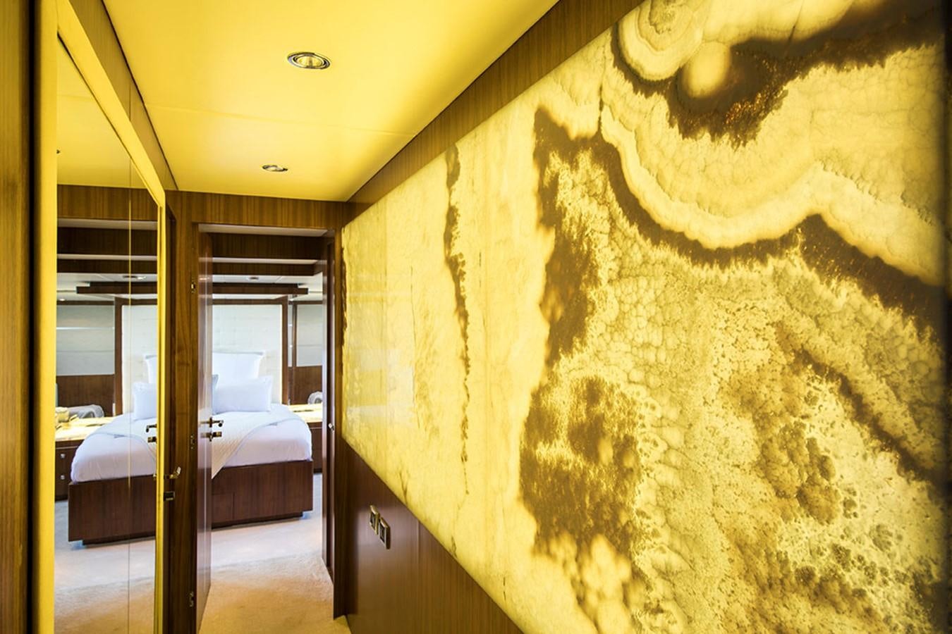 a room with a bed and a rug aboard ETOUPE Yacht for Sale