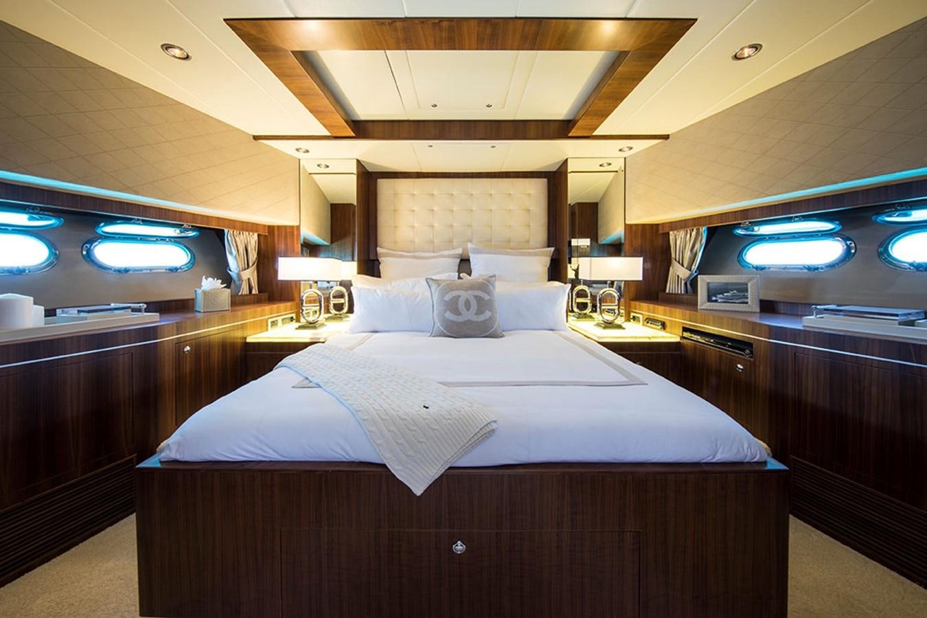a room with a bed and a desk aboard ETOUPE Yacht for Sale