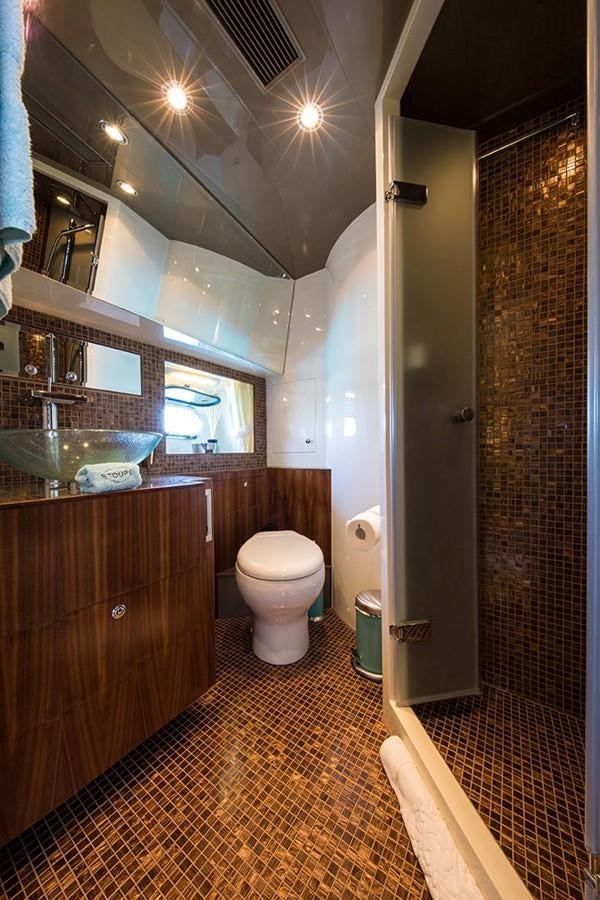 a bathroom with a glass shower aboard ETOUPE Yacht for Sale