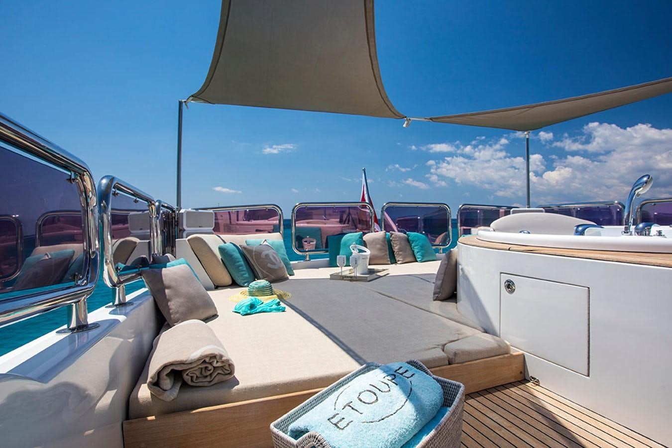 a boat with a bed and a blue sky aboard ETOUPE Yacht for Sale