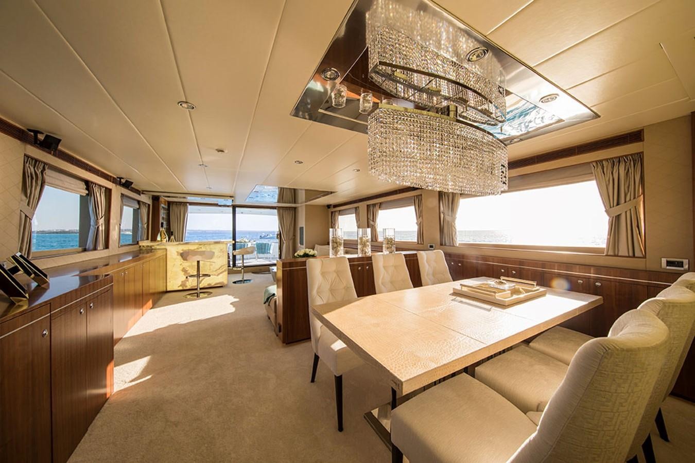 a room with a table and chairs aboard ETOUPE Yacht for Sale