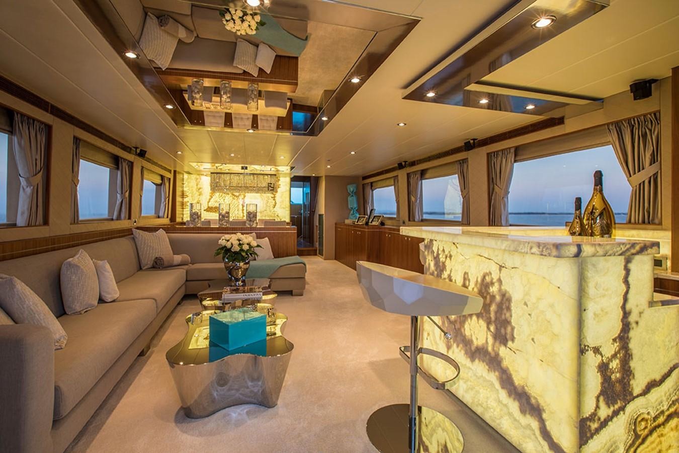 a living room with a large fireplace aboard ETOUPE Yacht for Sale