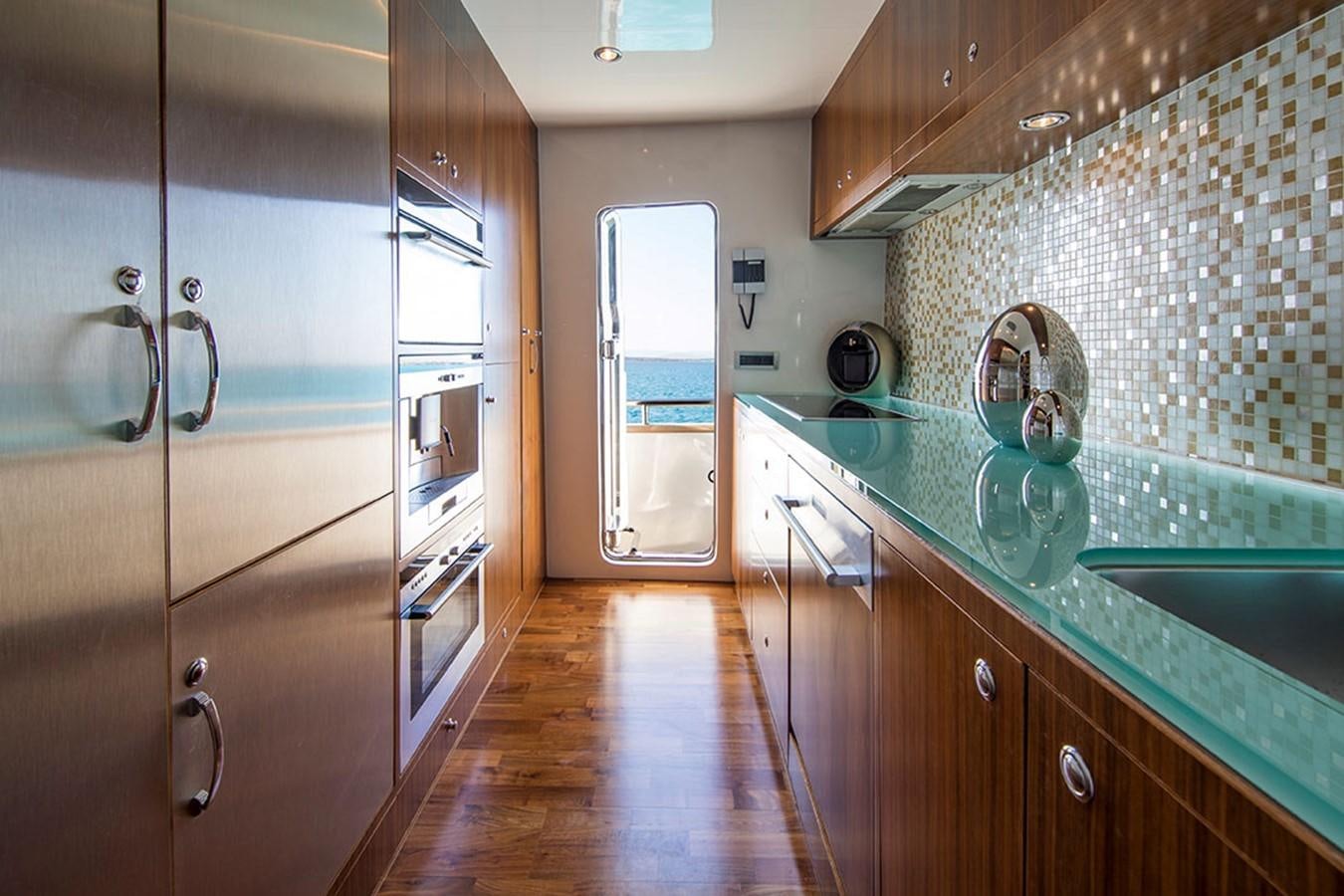 a kitchen with a large glass shower aboard ETOUPE Yacht for Sale