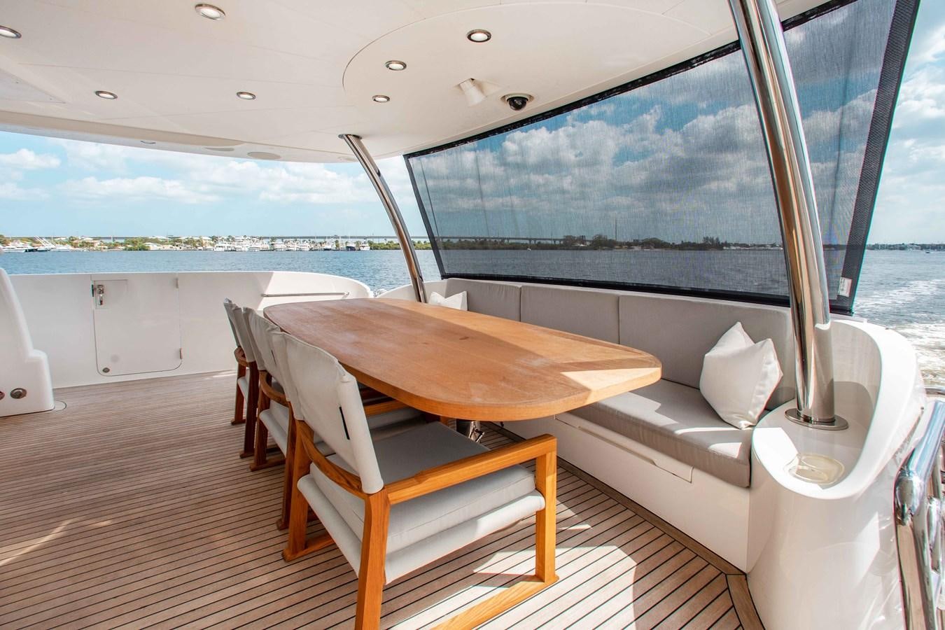 a room with a table and chairs aboard ISLAND SOUL Yacht for Sale