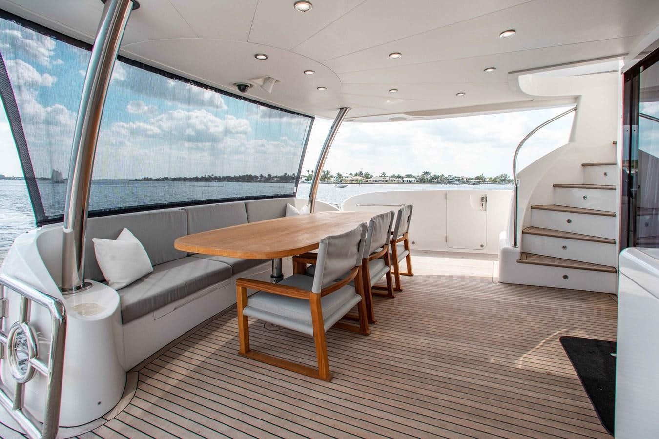 a room with a table and chairs aboard ISLAND SOUL Yacht for Sale