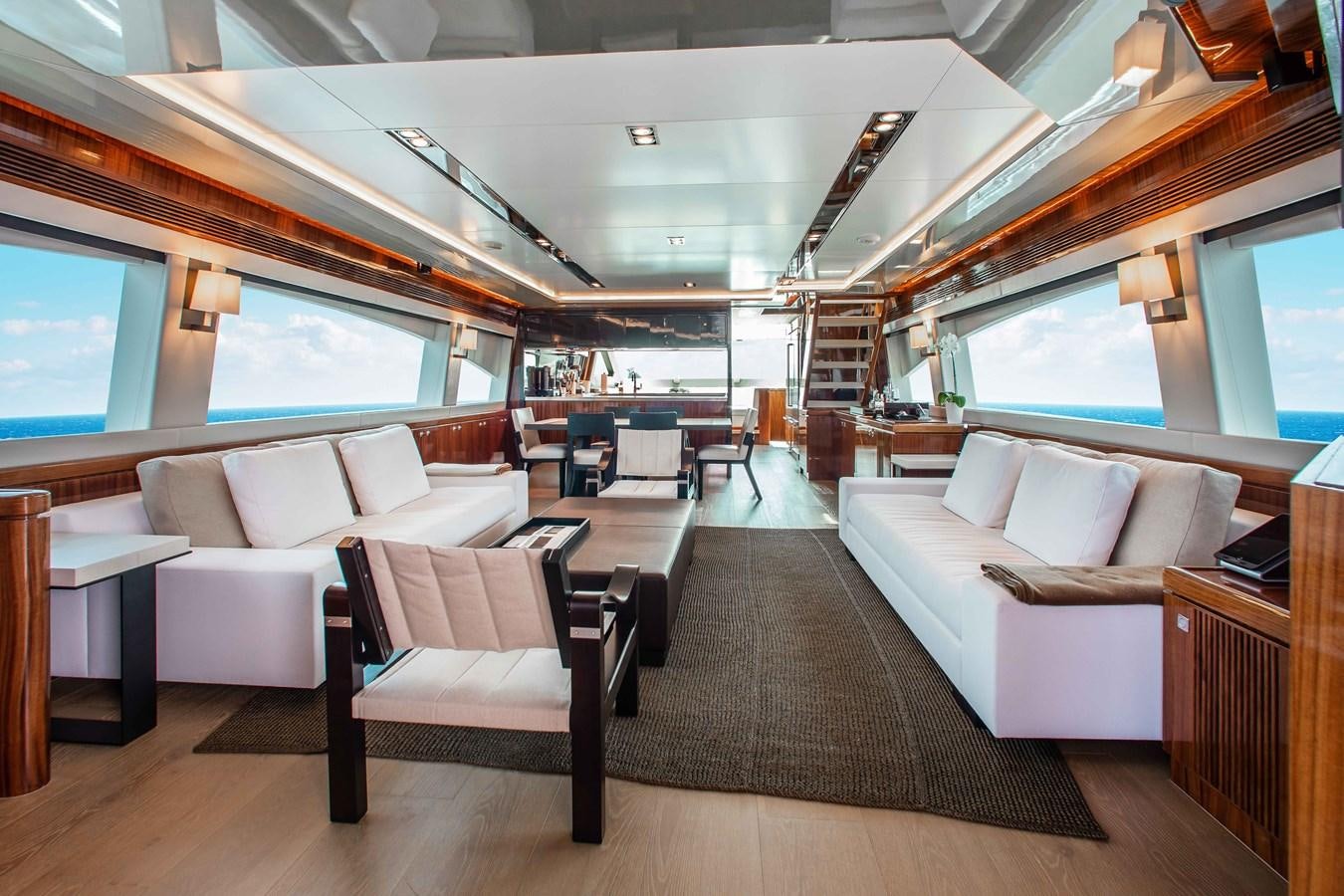 a large room with couches and a television aboard ISLAND SOUL Yacht for Sale