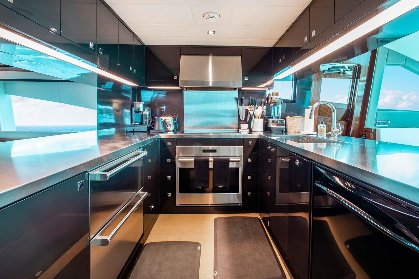 a kitchen with stainless steel appliances aboard ISLAND SOUL Yacht for Sale