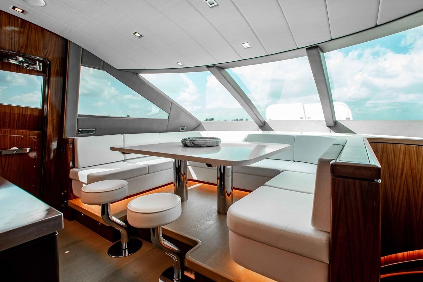a room with a table and chairs aboard ISLAND SOUL Yacht for Sale