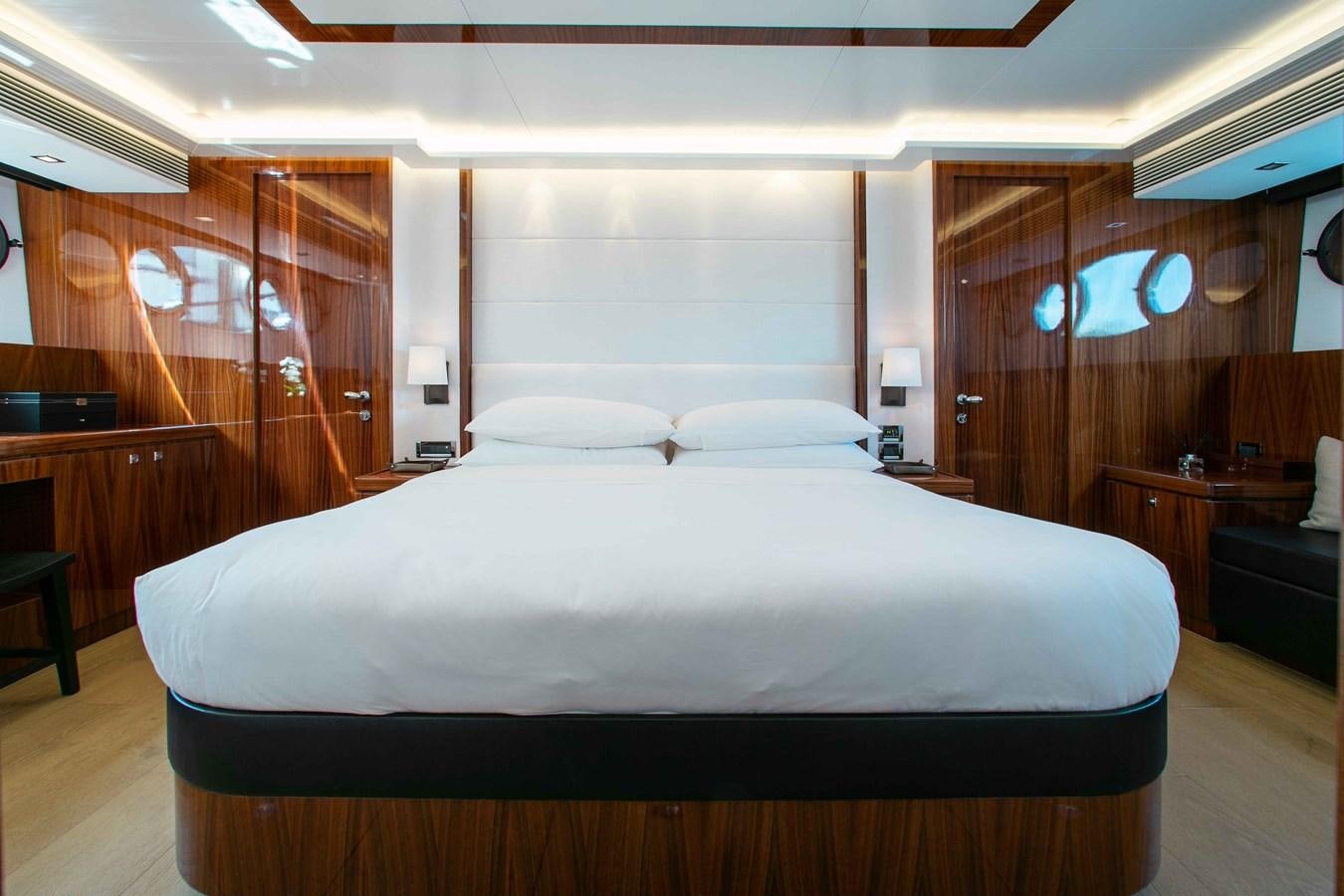 a bed with white sheets aboard ISLAND SOUL Yacht for Sale