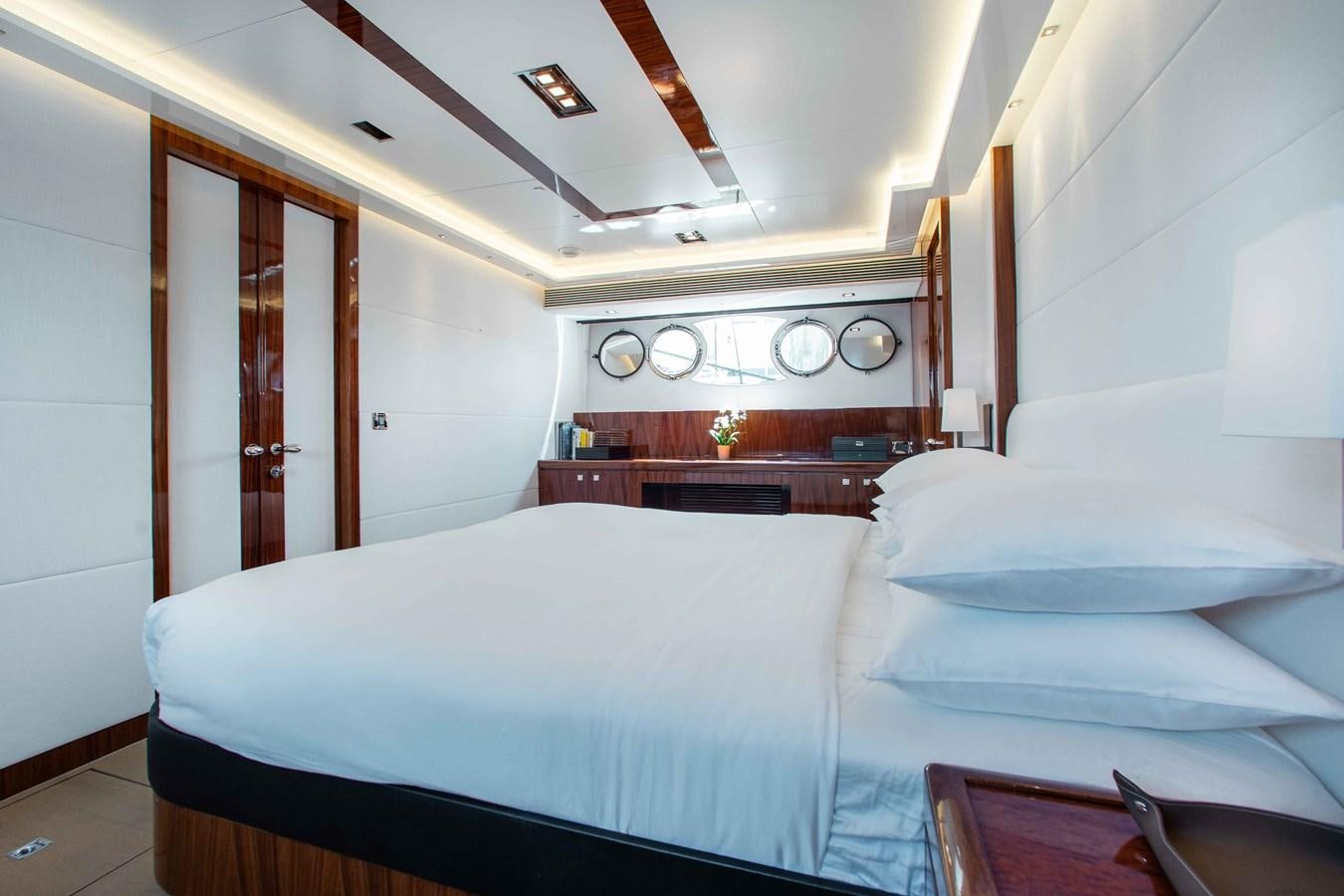 a room with a bed and a desk aboard ISLAND SOUL Yacht for Sale