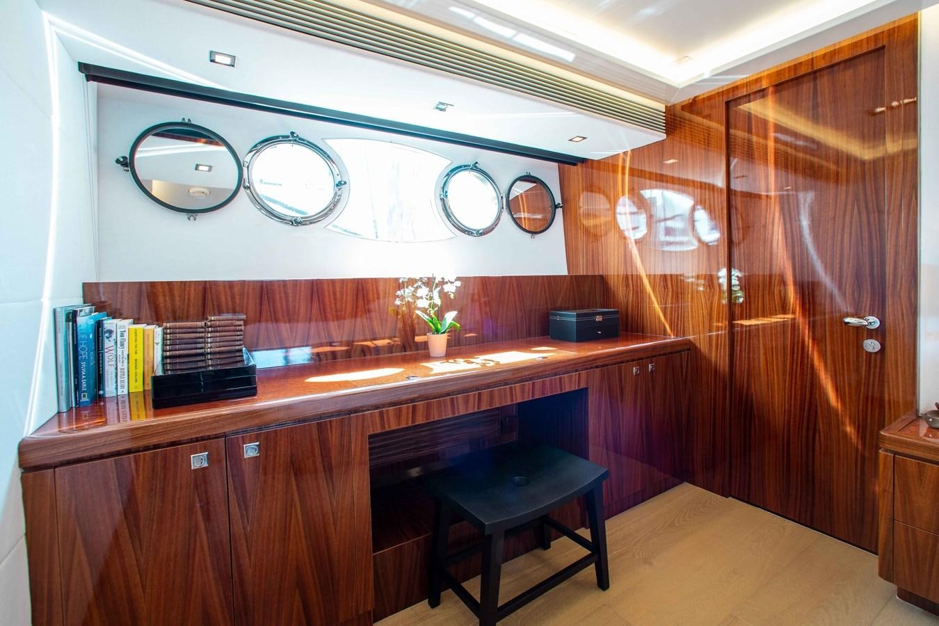 a room with a desk and a book shelf aboard ISLAND SOUL Yacht for Sale