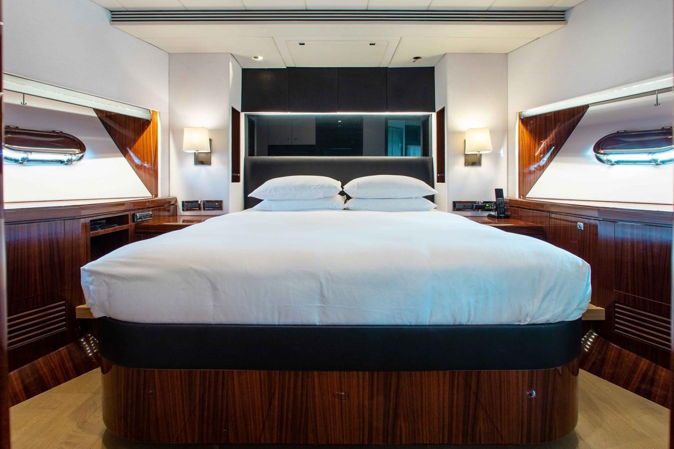 a bed with a white sheet aboard ISLAND SOUL Yacht for Sale