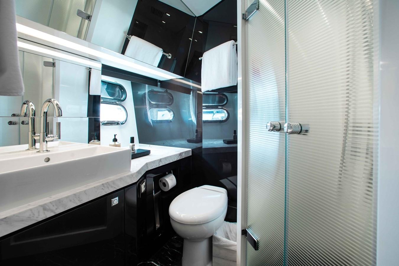 a bathroom with a toilet and sink aboard ISLAND SOUL Yacht for Sale