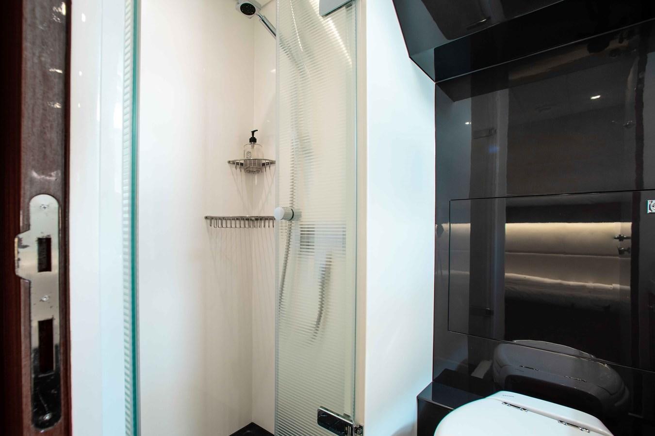 a bathroom with a toilet and a sink aboard ISLAND SOUL Yacht for Sale