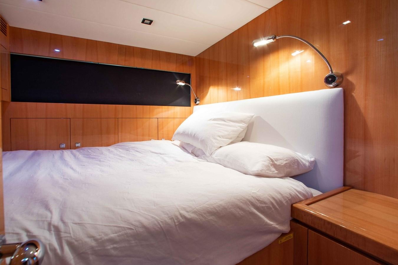 a bed with white sheets aboard ISLAND SOUL Yacht for Sale