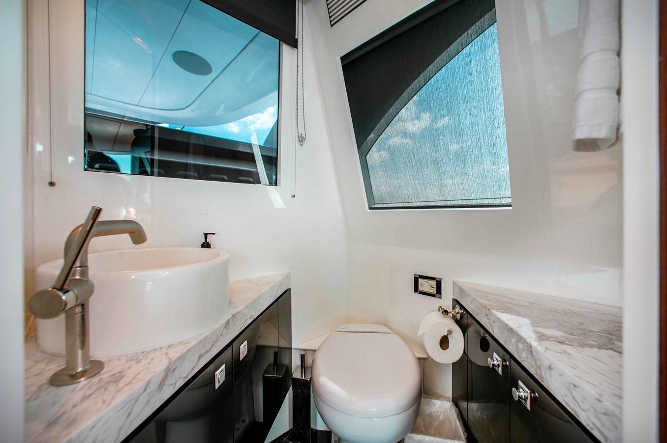 a bathroom with a sink and a toilet aboard ISLAND SOUL Yacht for Sale