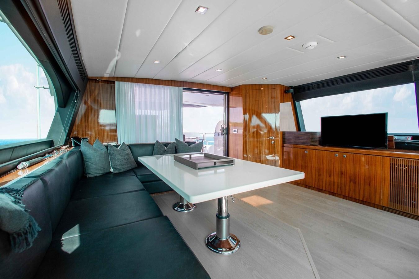 a living room with a couch and a table aboard ISLAND SOUL Yacht for Sale