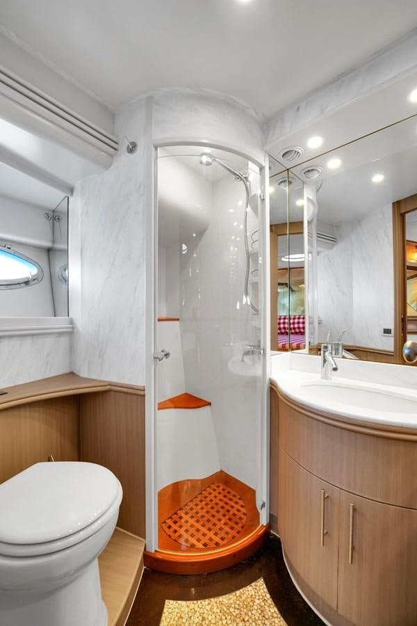 a bathroom with a shower and toilet aboard PERSHING 88/07 Yacht for Sale