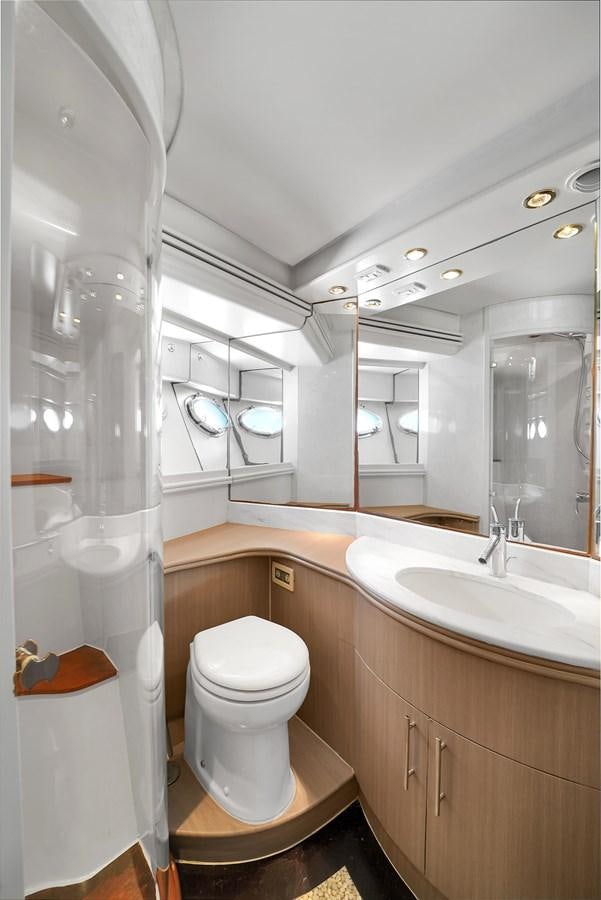a bathroom with a toilet and sink aboard PERSHING 88/07 Yacht for Sale