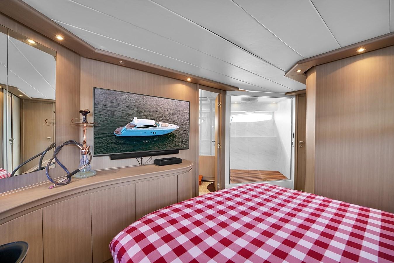 a bed in a room aboard PERSHING 88/07 Yacht for Sale