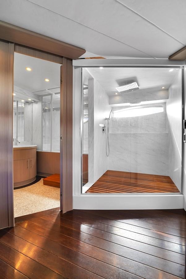 a large room with a large glass door and a large mirror aboard PERSHING 88/07 Yacht for Sale