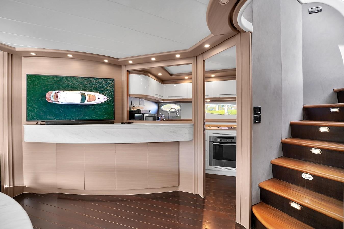 a room with a tv and a fireplace aboard PERSHING 88/07 Yacht for Sale
