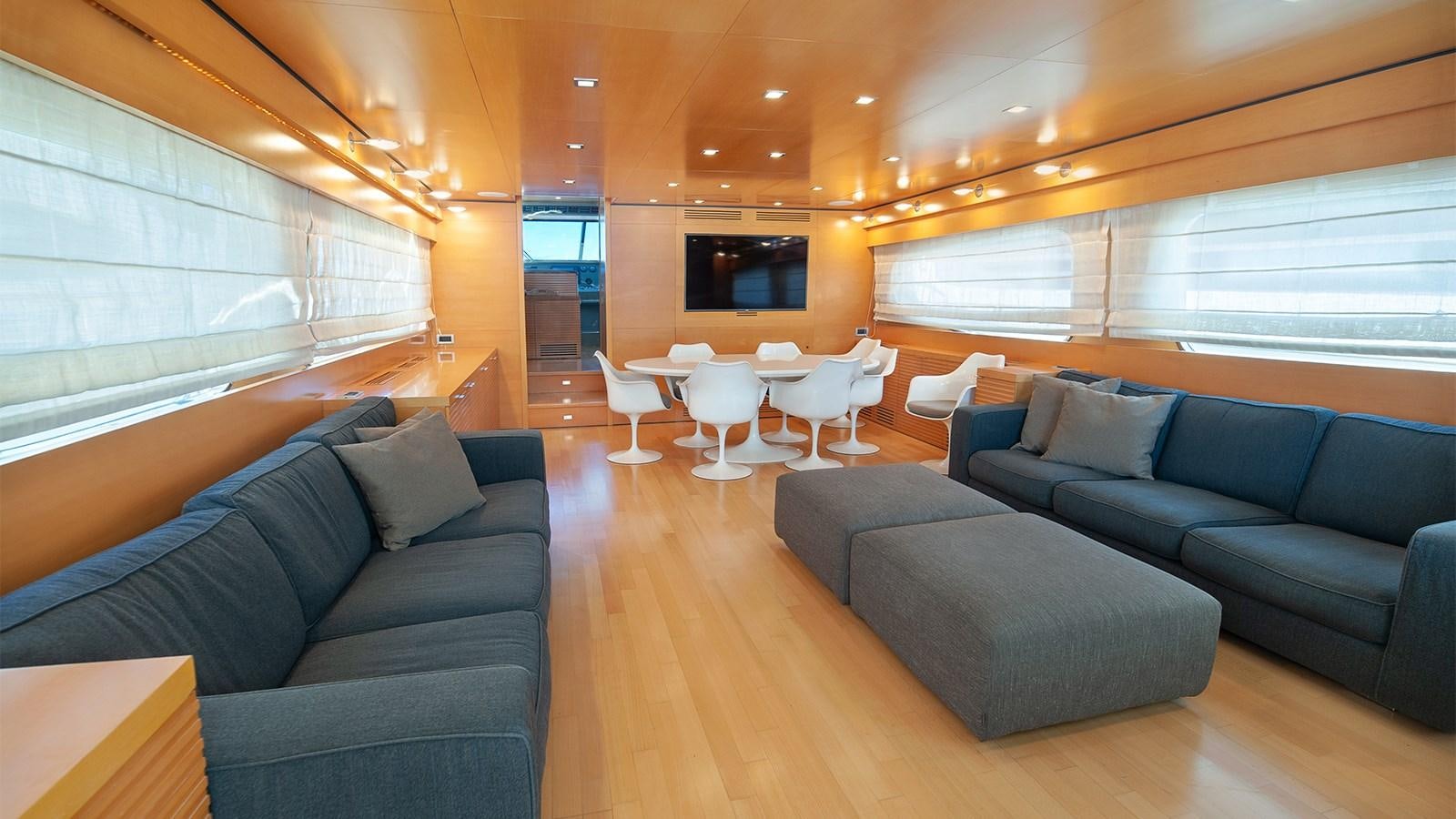 a living room with a couch and a table aboard AMYMONE Yacht for Sale