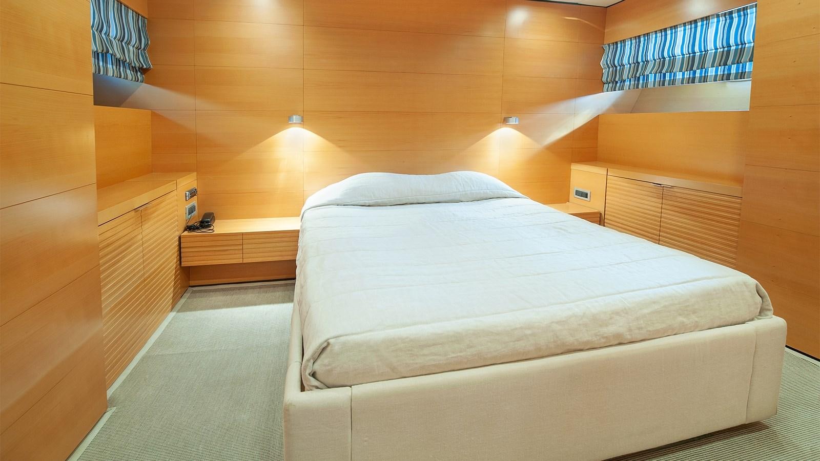 a bed in a wooden room aboard AMYMONE Yacht for Sale