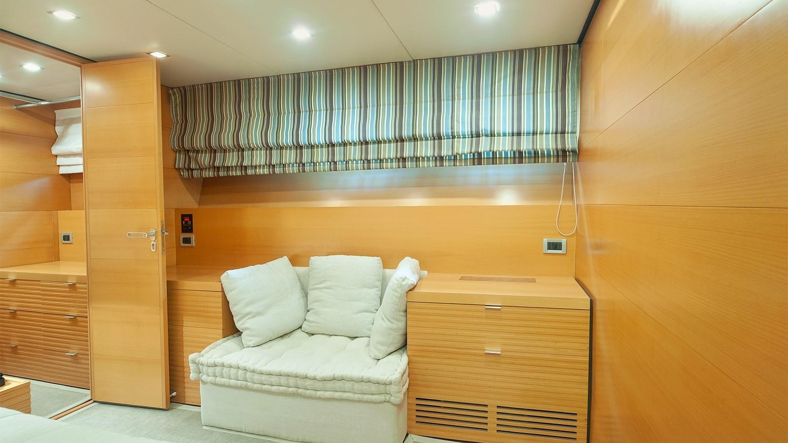 a room with a bed and a dresser aboard AMYMONE Yacht for Sale