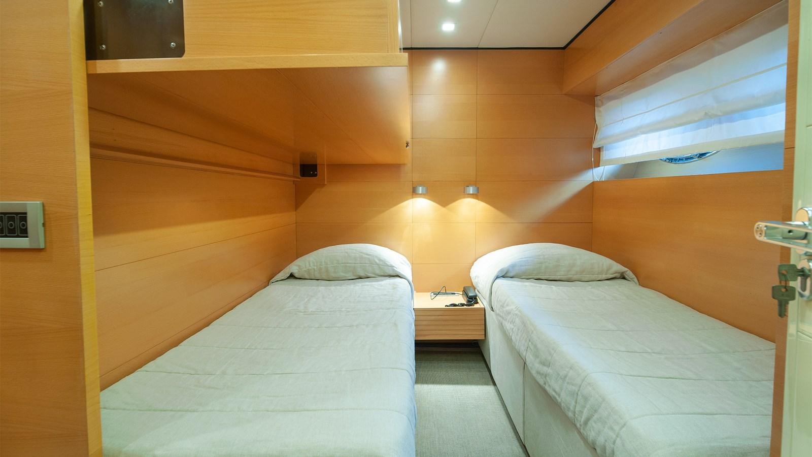 a room with two beds aboard AMYMONE Yacht for Sale