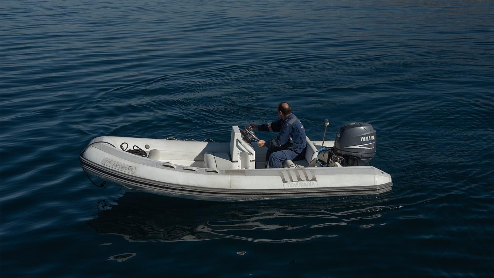 a man on a boat aboard AMYMONE Yacht for Sale