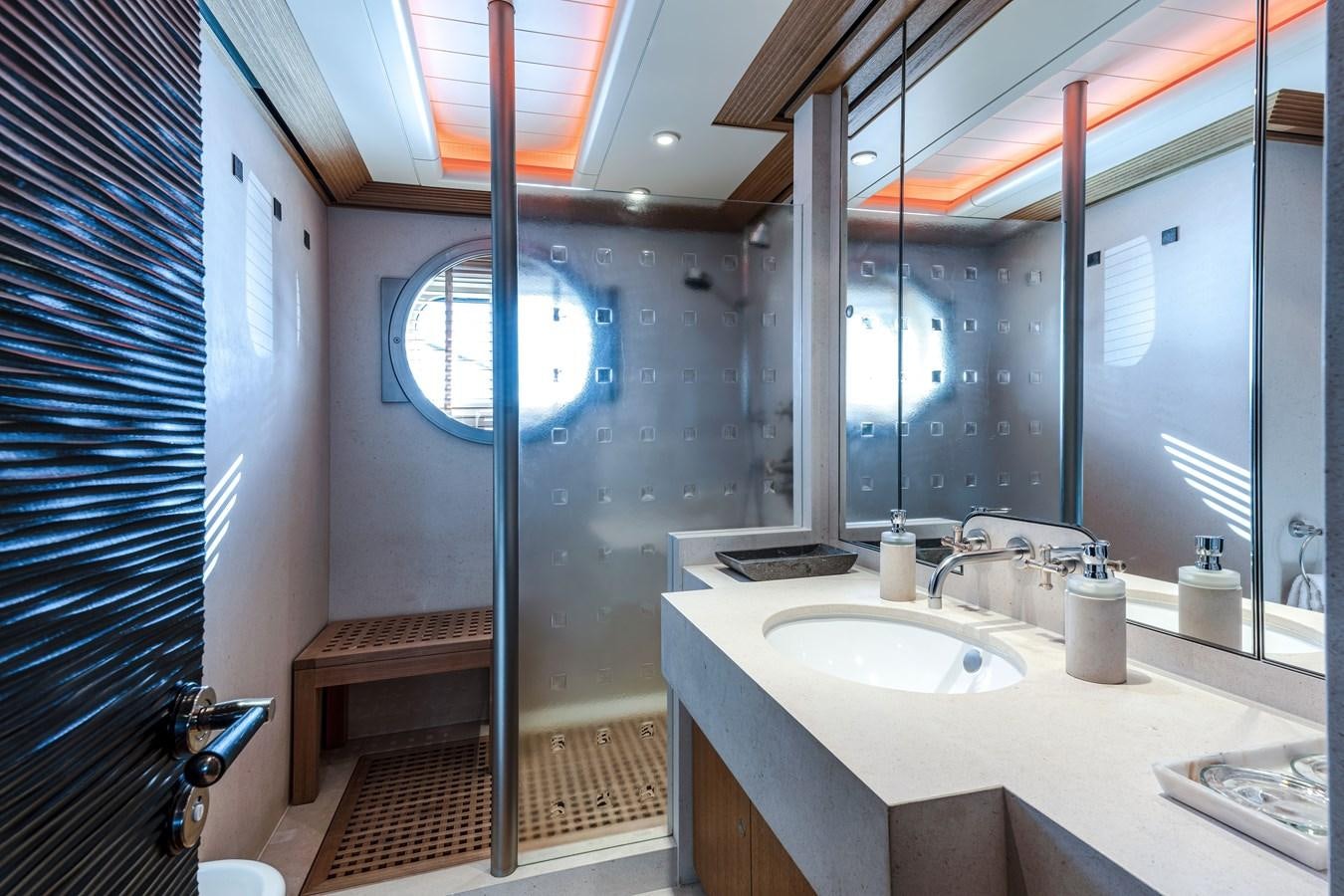 a bathroom with a shower and sink aboard KOGO Yacht for Sale