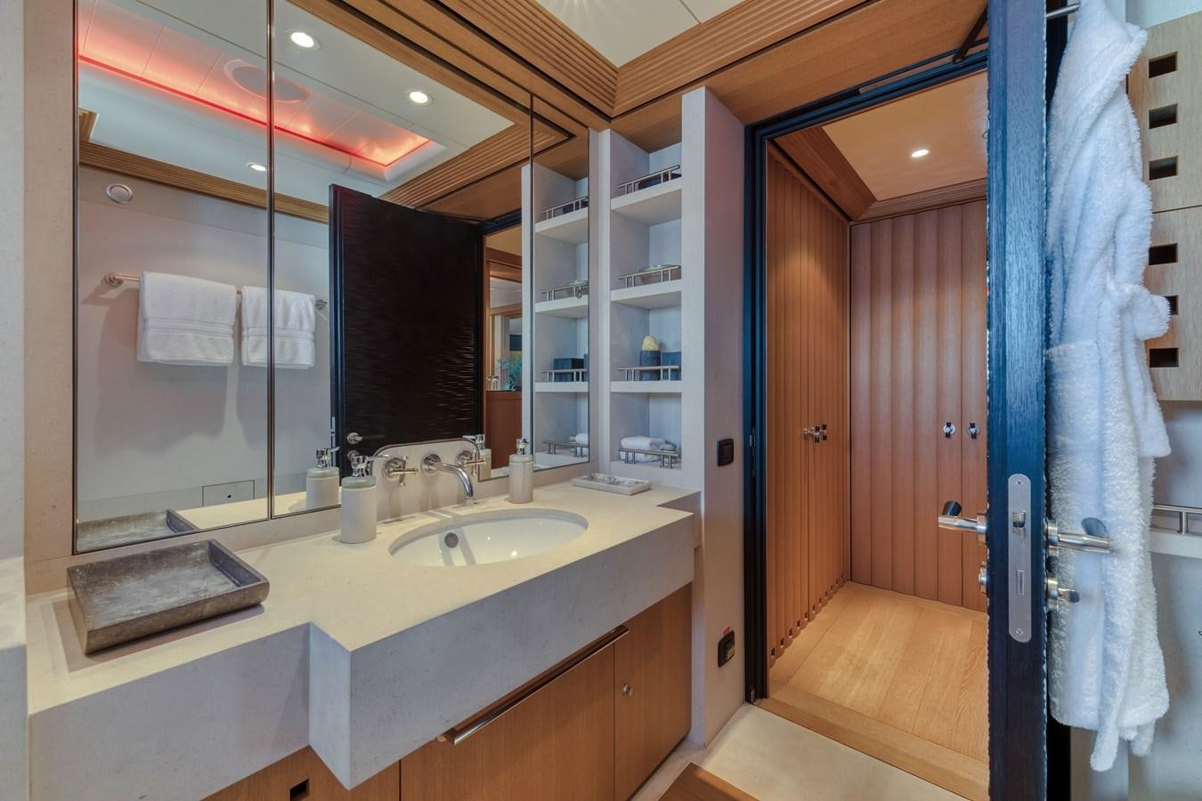 a bathroom with a sink and a mirror aboard KOGO Yacht for Sale