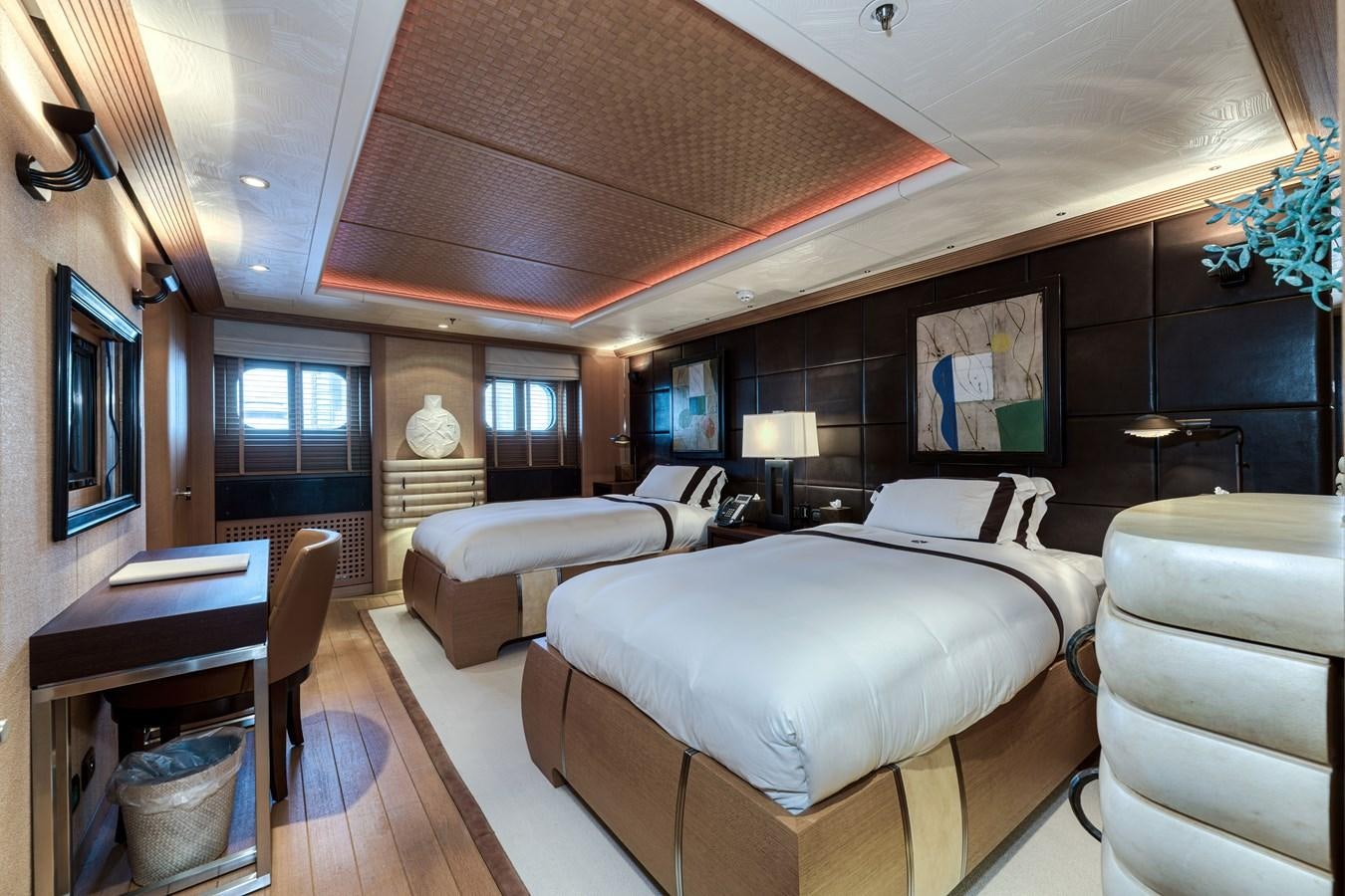 a room with a bed and a desk aboard KOGO Yacht for Sale