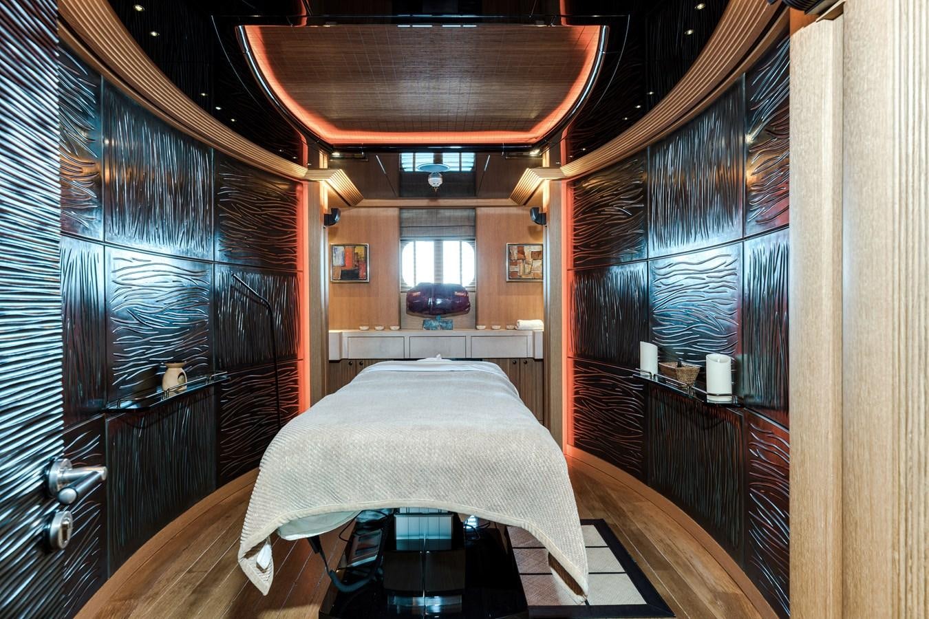 a room with a bed and a window aboard KOGO Yacht for Sale