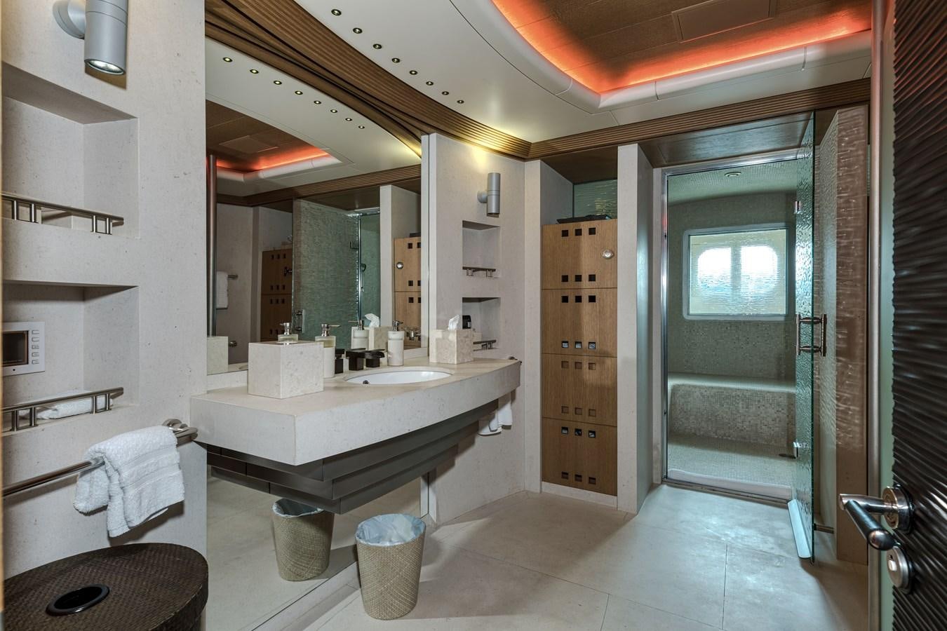 a bathroom with a sink and a mirror aboard KOGO Yacht for Sale