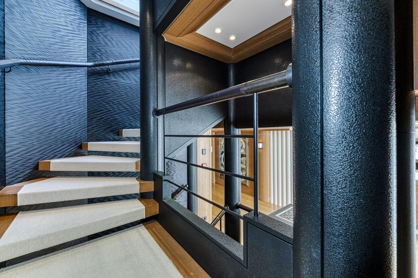 a staircase in a building aboard KOGO Yacht for Sale
