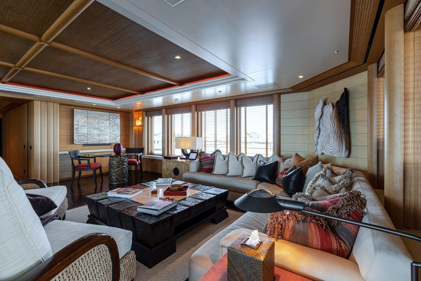 a living room with a couch and a coffee table aboard KOGO Yacht for Sale
