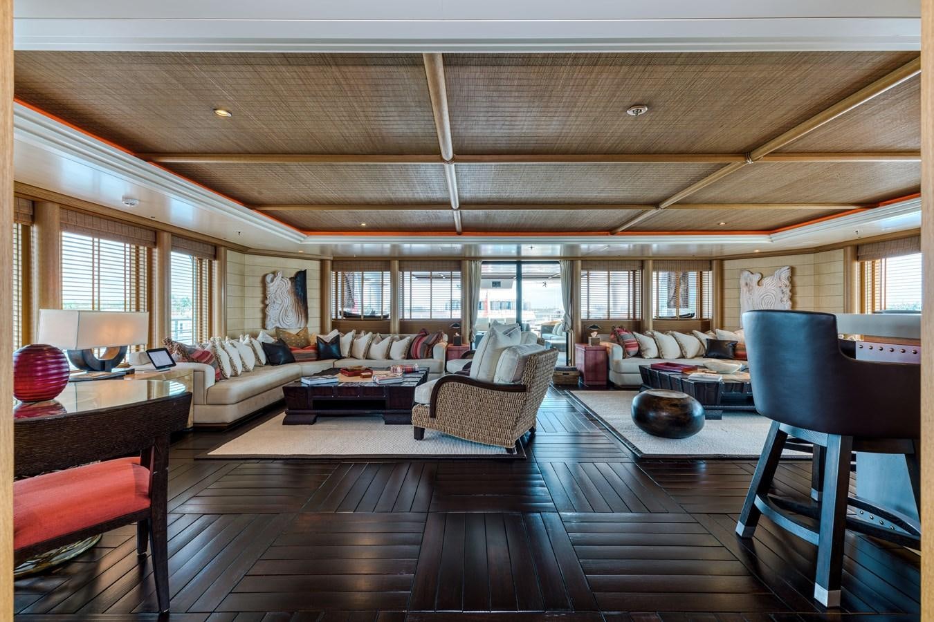 a large living room with a wood floor aboard KOGO Yacht for Sale
