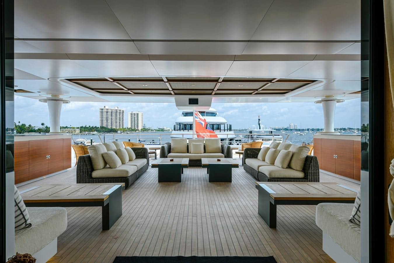 a room with couches and a table and chairs aboard KOGO Yacht for Sale