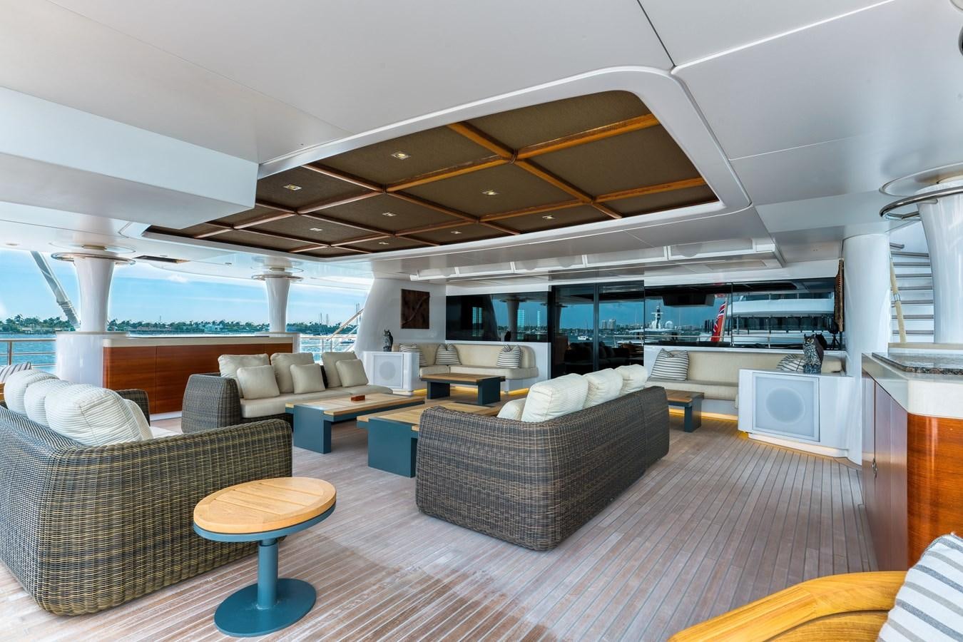 a large living room with a large open roof aboard KOGO Yacht for Sale