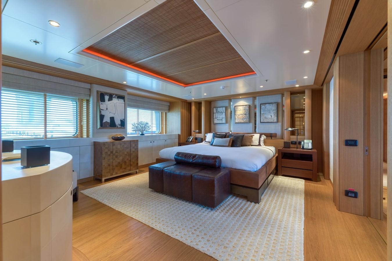 a large living room with a large bed and a large window aboard KOGO Yacht for Sale