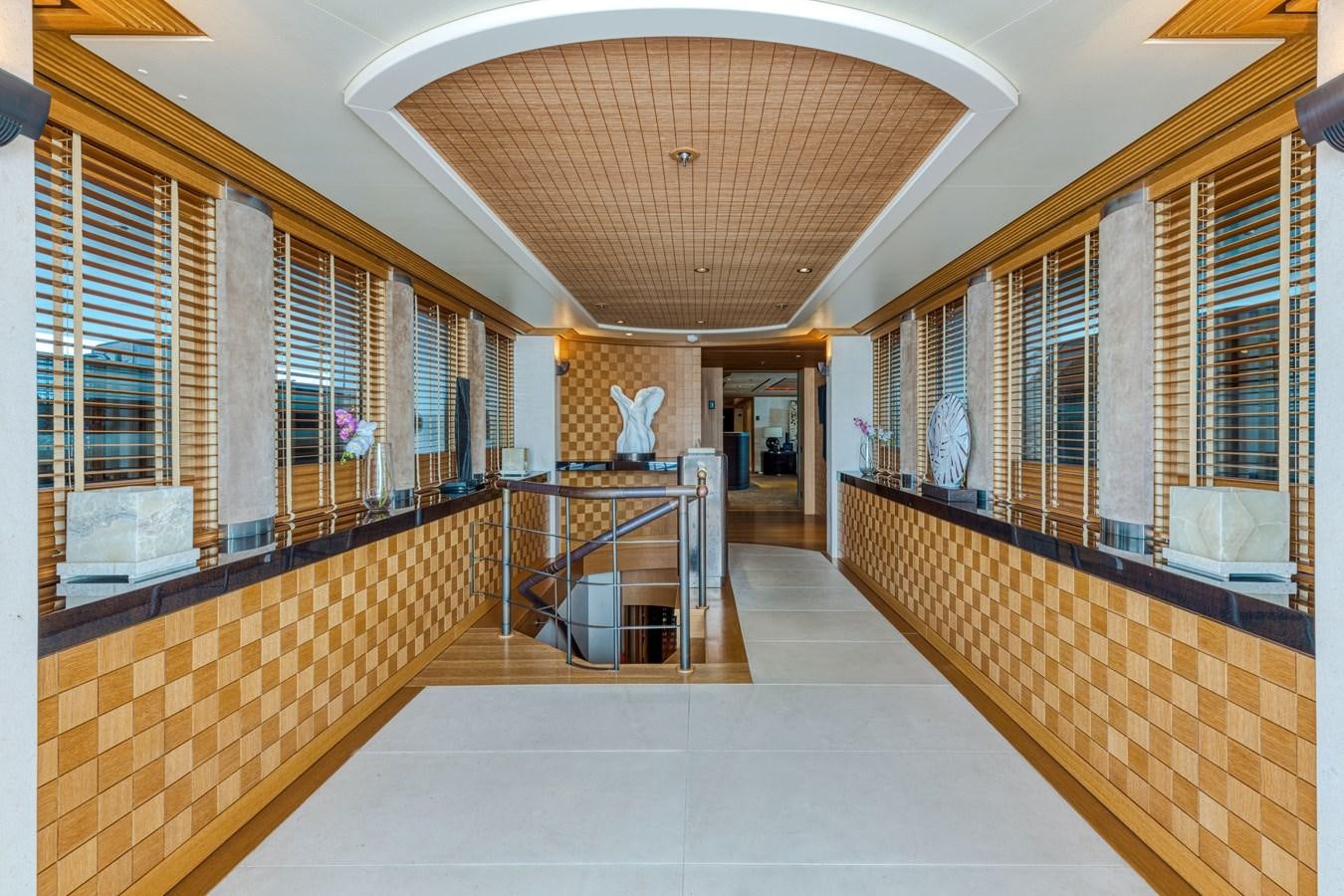 a long hallway with a large ceiling aboard KOGO Yacht for Sale